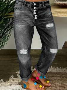 Vue détaillée jean femme taille haute stretch déchiré avec boutons style urbain