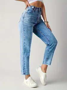 Close-up detail of women's high-waisted washed denim jeans, showing stretch fabric texture.