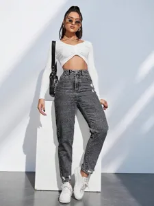 Dames high waist acid wash verwassen spijkerbroek met destroyed details en casual pasvorm.
