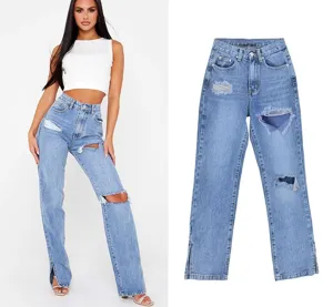Detail shot of light blue straight leg jeans with distressing and hem slits for women fashion.