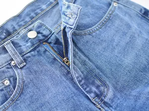 Women blue denim jeans pants fly zipper detail close up stylish casual bottom wear apparel