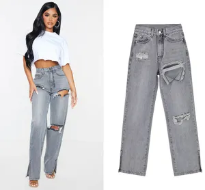 Women's grey distressed high waist straight leg jeans with trendy slit hem fashion design.