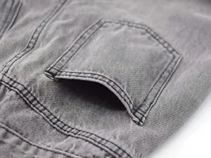 Grey washed denim jeans detail shot showing exquisite pocket and sturdy stitching design.