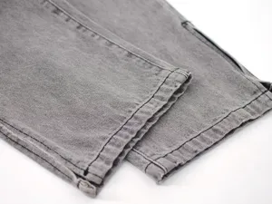 Women grey denim split straight pants detail, stylish street style casual trousers.
