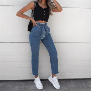 High waist paperbag denim jeans detail, featuring frayed hem and stylish tie belt.