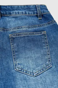 Detail shot of classic blue denim jeans showing the back pocket and waistband construction.
