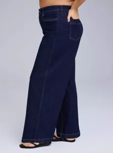 Detail view of dark blue stretch denim jeans, featuring contrast stitching and classic pockets.