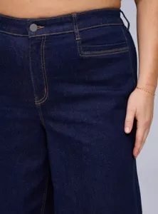 Plus size high-waisted stretch denim jeans close-up detail showcasing classic styling.