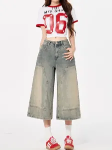 Detailed view of women's loose washed denim cropped wide-leg jeans with vintage style.