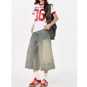 Retro distressed wide leg denim capri pants for women, vintage washed fashion culottes.