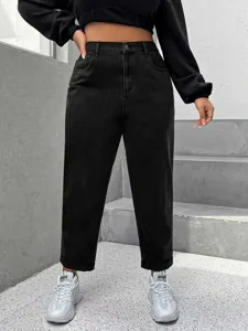 Close-up detail of stylish black washed denim jeans showcasing fit and texture design.