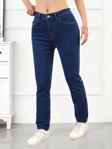 Detail view of dark blue stretch skinny jeans featuring high waist and metal button closure.
