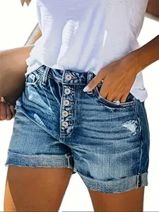 High waist multi button ripped denim shorts detail showing casual summer style apparel.