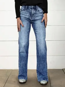 Women's high-waisted acid wash straight leg denim jeans detail view showcasing fabric texture