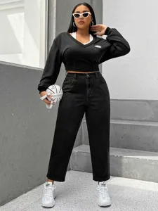 Black washed denim jeans featuring a stylish casual fit, perfect for plus size women's daily wear.