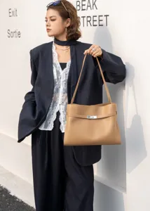 Retro beige underarm shoulder bag for women, stylish leather tote with metal lock design.