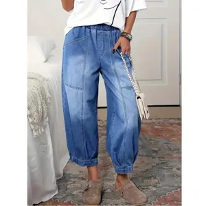Women's casual high-waisted loose denim harem pants with elastic waist and vintage wash.