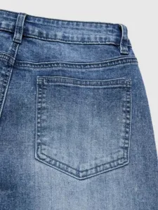 Women's classic blue denim jeans detail shot showcasing the back pocket and waistband.