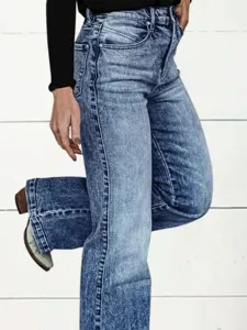 Detail view of women high waisted acid wash denim jeans straight leg casual daily wear blue