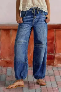 Women's casual loose denim jeans with drawstring waist, wide legs and cinched cuffs.