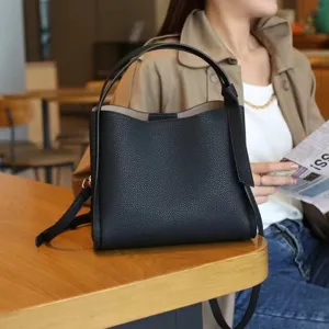Black leather bucket bag for women, stylish casual shoulder crossbody handbag with handle.