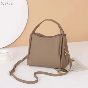 Genuine leather shoulder bag casual tote handbag with top handle and crossbody strap stylish.
