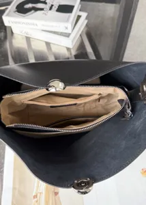 Large capacity black leather bucket bag, chic shoulder handbag with inner zipper pocket.