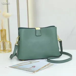 Green leather crossbody shoulder bag for women, stylish and spacious daily purse.