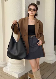 Black leather hobo shoulder bag detail shot, showing large capacity and stylish daily wear.