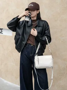 White leather shoulder bag with chain strap and zipper pockets for daily casual wear