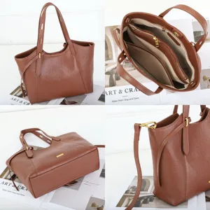 Leather tote bag detail view, premium brown shoulder bag with multiple compartments inside.