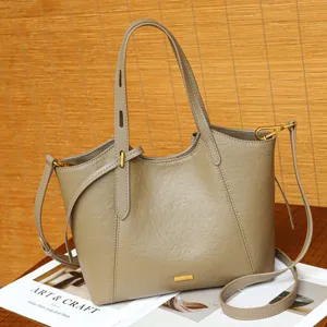 Details of stylish casual shoulder tote bag featuring clean stitching and metal hardware.