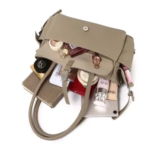 Detailed top view of a multi-compartment leather handbag showing large capacity and neat interior.