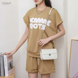 Chic white leather shoulder bag paired with casual khaki outfit for women, stylish daily.