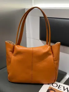 Orange leather tote bag for women, large capacity casual shoulder bag, soft leather daily handbag.