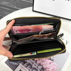 Detailed view of genuine leather women's long wallet showing multiple card slots and cash compartments.