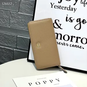 Detailed view of the genuine leather long wallet in light khaki with textured finish and zipper.