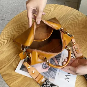 Detail view of the vintage brown leather Boston bag showing its interior structure.