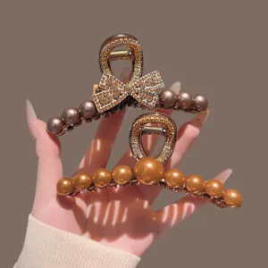 Elegant Korean pearl bow hair claw clip, large metal shark clip for chic hairstyles, women fashion.