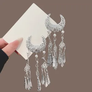 Traditional Chinese style crescent tassel hair clip with intricate hollow metal design for hanfu.