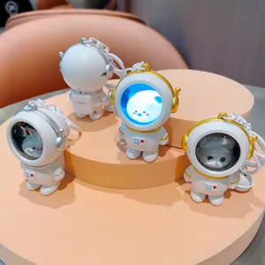 Detailed view of the cute astronaut keychain with glowing bear night light feature, premium design.