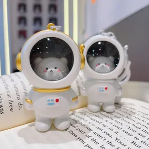 Cute astronaut bear keychain pendant with glowing night light design, perfect creative gift.