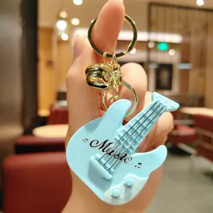 Cute guitar keychain mini music toy car key chain bag pendant gift for friends and kids.