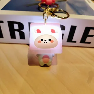 LED melkdoos sleutelhanger gedetailleerd overzicht, stralend schattig dier hanger close-up.