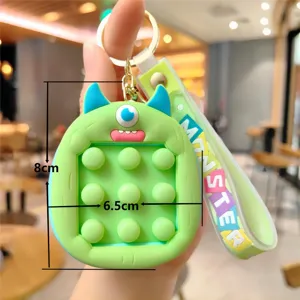 Grüner Silikon Monster Pop It Fidget Spielzeug Schlüsselanhänger Detailansicht 8x6,5cm.