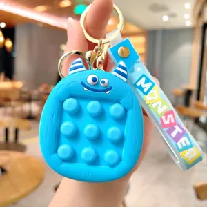 Süßer blauer Monster Push Pop Blasen Zappel Schlüsselanhänger Silikon Dekompression Tasche