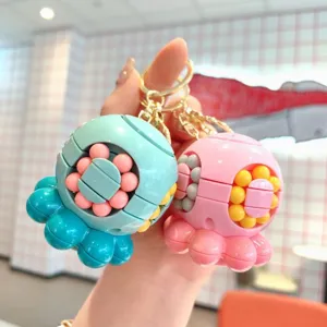 Close-up detail of cute octopus rotating magic cube keychain, colorful fidget toy pendant.