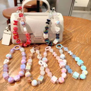 Colorful acrylic beaded bag charm and keychain detail, featuring vibrant assorted colorful styles.