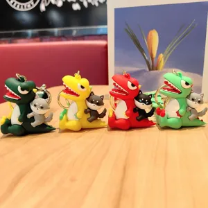 Detailed view of cute cartoon dinosaur keychain with small animal figurine, PVC material.