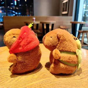 Cute capybara plush keychain with strawberry hat and bag, soft toy bag charm pendant.